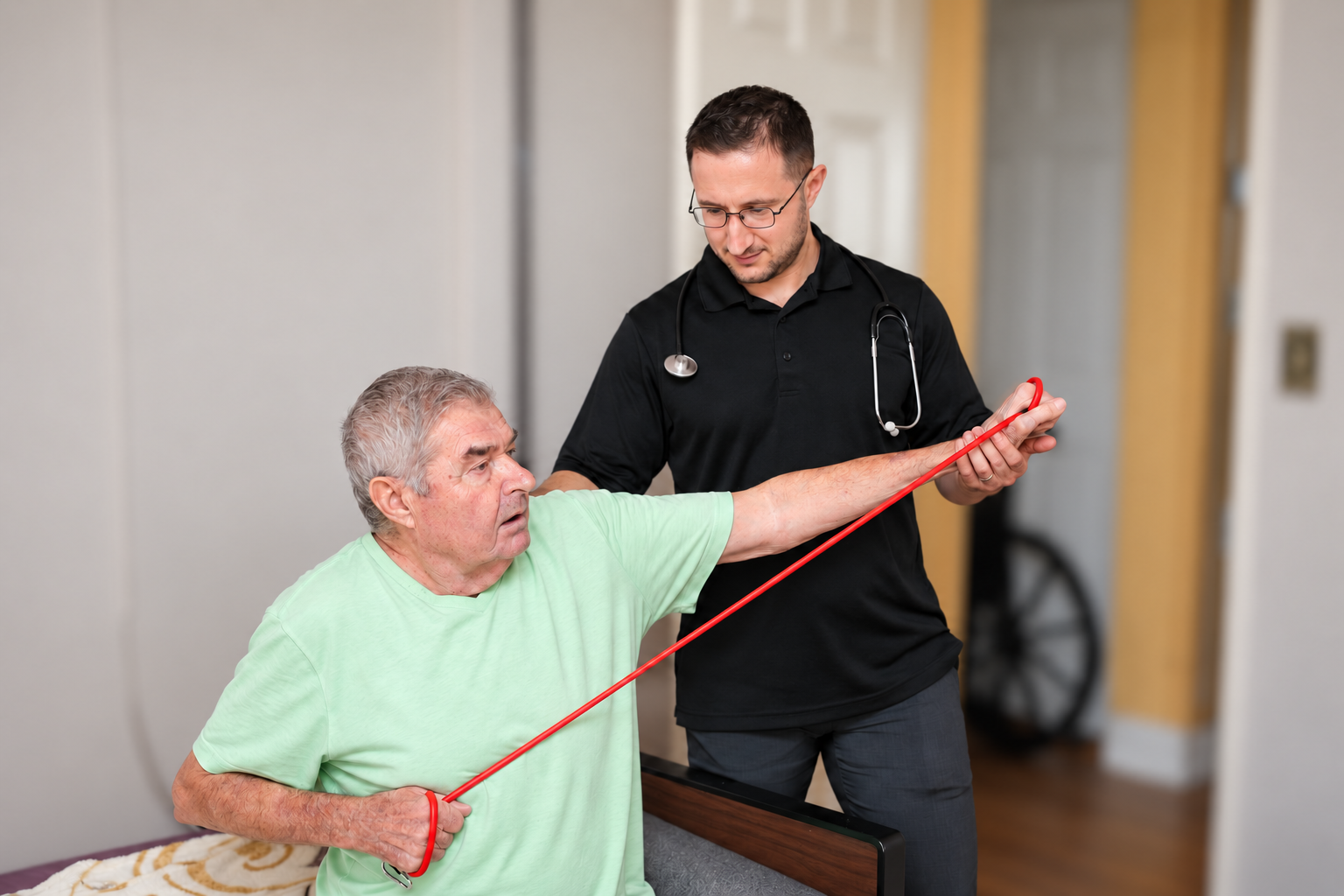 Dr. Lenny providing hands-on physical therapy during an in-home visit in natural light